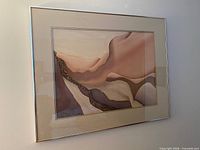 Full view of framed abstract print under glass, thin silver frame, mat