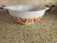 Side view showing Friendship pattern and one pouring handle