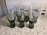 All six smoky gray glass tumblers front view