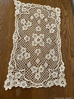 Full view of one doily showing pattern and edges