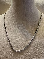 Necklace displayed on bust showing full length and link style