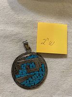 Front view showing turquoise mosaic design and size note