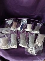 All ten sealed fabric catnip toys on purple background