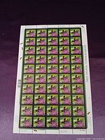 Front view of entire stamp sheet showing 50 unseparated stamps
