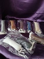 All eight sealed fabric catnip toys on purple backdrop