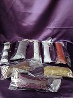 All eight individually wrapped catnip toys displayed on purple background