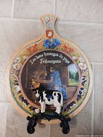 Cheese board on cast iron cow stand showing overall set