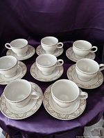Full set of 8 cups with saucers displayed