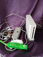 Nintendo Wii console, power adapter, AV cable, Komodo remote, nunchuk