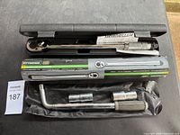 Torque wrench and breaker bar with sockets displayed