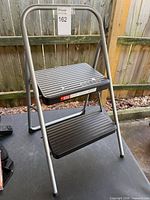 Step stool open showing two steps and frame