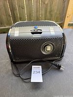 Front and top view of Holmes aer1 air purifier with power cord visible