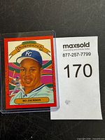 Front view of card in sleeve with lot reference