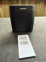 Front view showing Bose logo and perforated grill