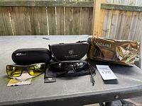 All three eyewear sets with cases and packaging