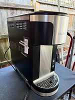 Three-quarter side view showing overall form and power cord