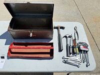 Overall lot view showing Craftsman toolbox, interior tray, and grouped hand tools