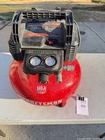 Front view showing full compressor, gauges, tank markings, size reference