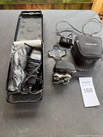 Overall view of rotary shaver with case and hair clipper kit