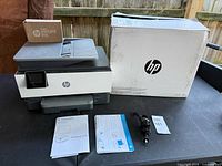 Printer, box, manuals, power cord, Instant Ink pack overview