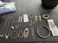 Overview of all jewellery pieces laid out on table