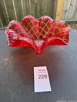 Side view showing ruffled rim and color gradient