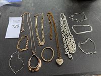 All necklaces and bracelets laid out on black surface