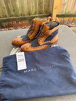 Boots side view and dust bag