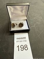 Pair of cufflinks in presentation box with lot number card
