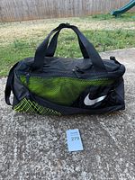 Front view showing green mesh panel and swoosh logo