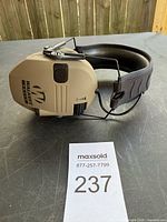 Left side showing Walker's Razor logo, volume/power knob, microphone port