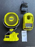 Ryobi fan, charger base and AC adapter laid out