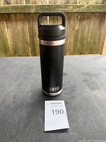 Full view of black Yeti Rambler tumbler standing upright