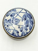 Top view showing blue and white porcelain lid with leafy pattern