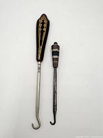 Front view of buttonhook and cutter side by side