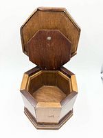 Box front view, lid open revealing interior