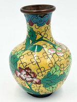 Front view of cloisonné vase showing yellow ground and floral design