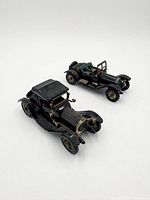 Two die-cast vintage cars full view