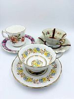 Overview of three teacup and saucer sets