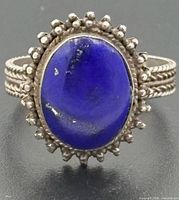 Front view of ring showing lapis lazuli stone and beaded halo