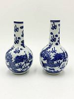 Front view of both vases showing dragon motif