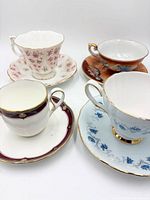Group shot of four teacup and saucer pairs displaying overall variety