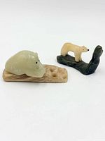 Overall view of both stone animal carvings