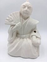 Front view of ceramic seated samurai planter with fan