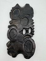 Top view showing carved floral design, recessed ovals, overall shape