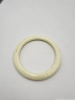 Cream ivory-tone rounded bangle bracelet front view