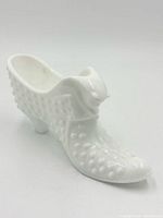 Right side view of slipper showing hobnail texture and cat head opening