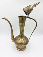 Full view of brass ewer with lid open showing spout, handle and etched design