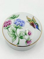 Top view showing full floral and butterfly design on lid