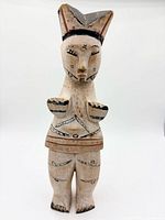 Front view of carved and painted Ibibio fertility doll